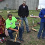 Andy watches David Manual from Red Lakes’ Local Food Initiative demonstrate how to parch wild rice over a fire at the Upper Midwest Food Sovereignty Summit last week.